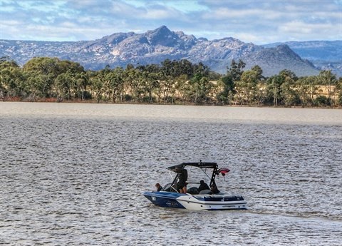 A speed boat stationary on green lake