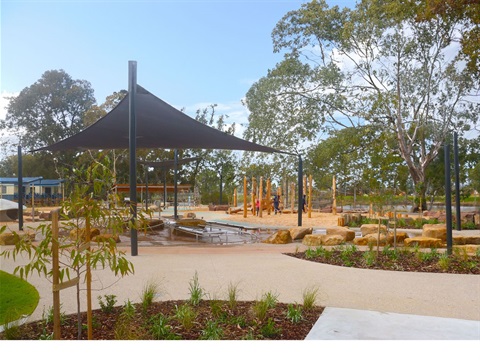 shade structure, garden beds and pathways