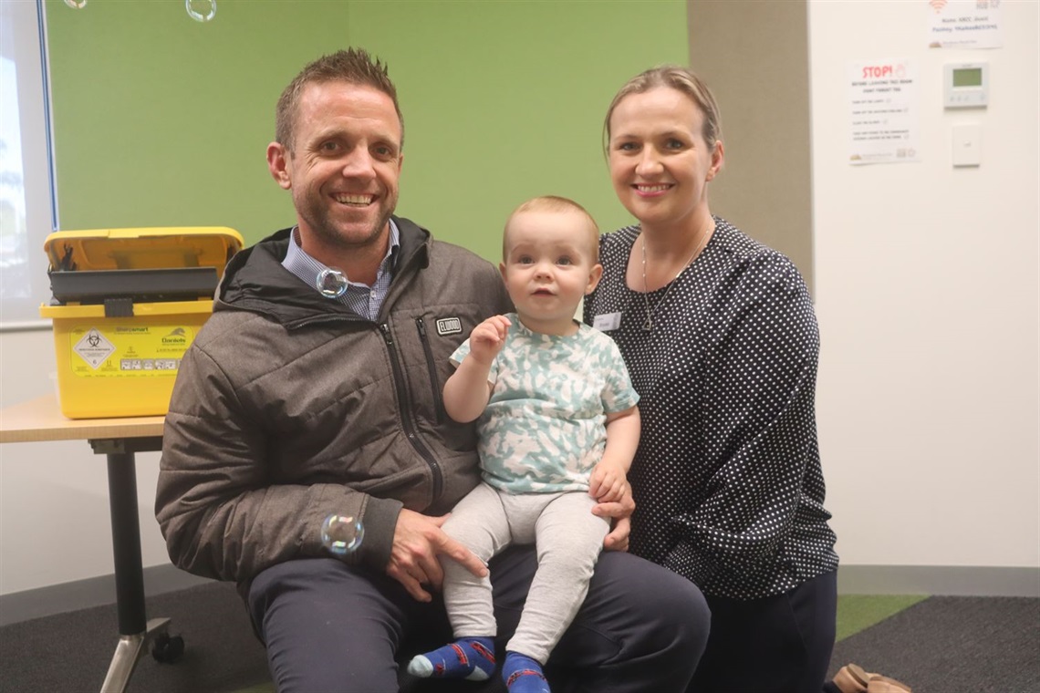 Dad Wade, child Henry and MCH nurse Brooke. Henry recieving flu vax.JPG