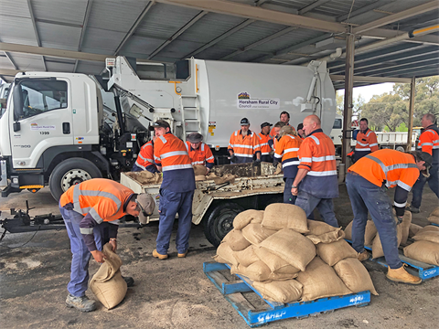 Sand bag preparation at the depot.png