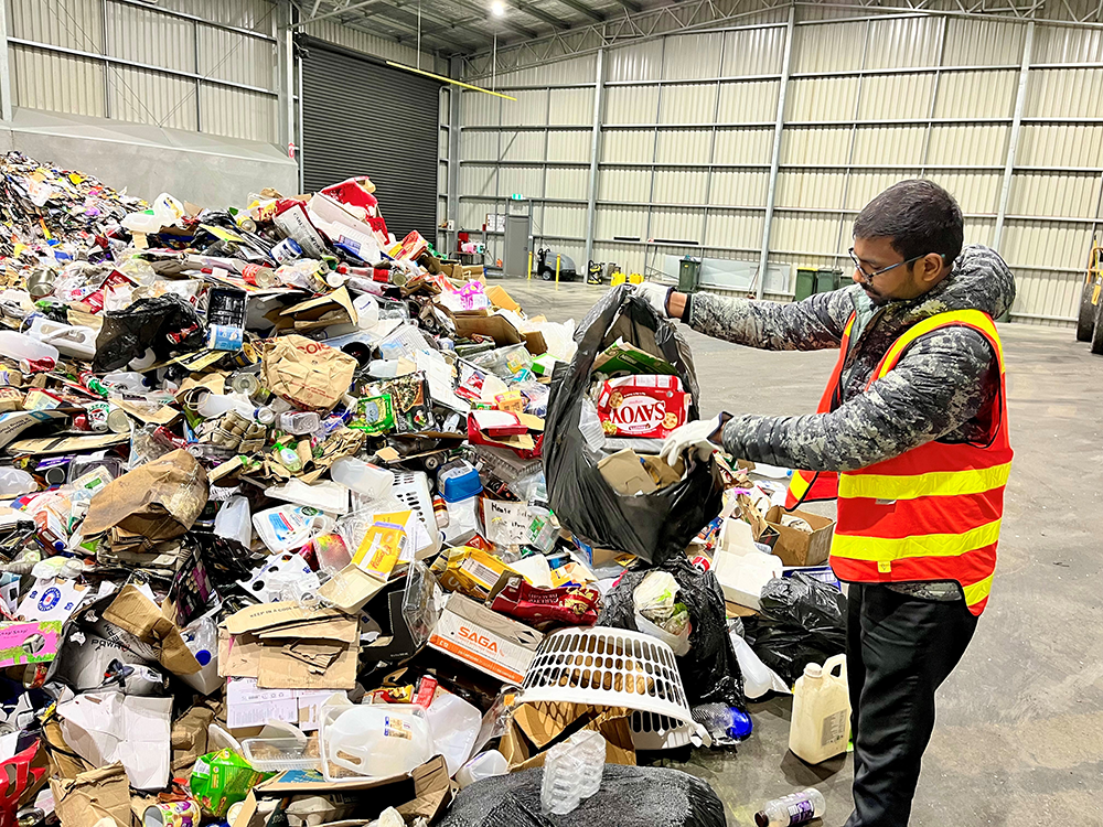 Viswatej Dadepogu with recycling in bags (web).png