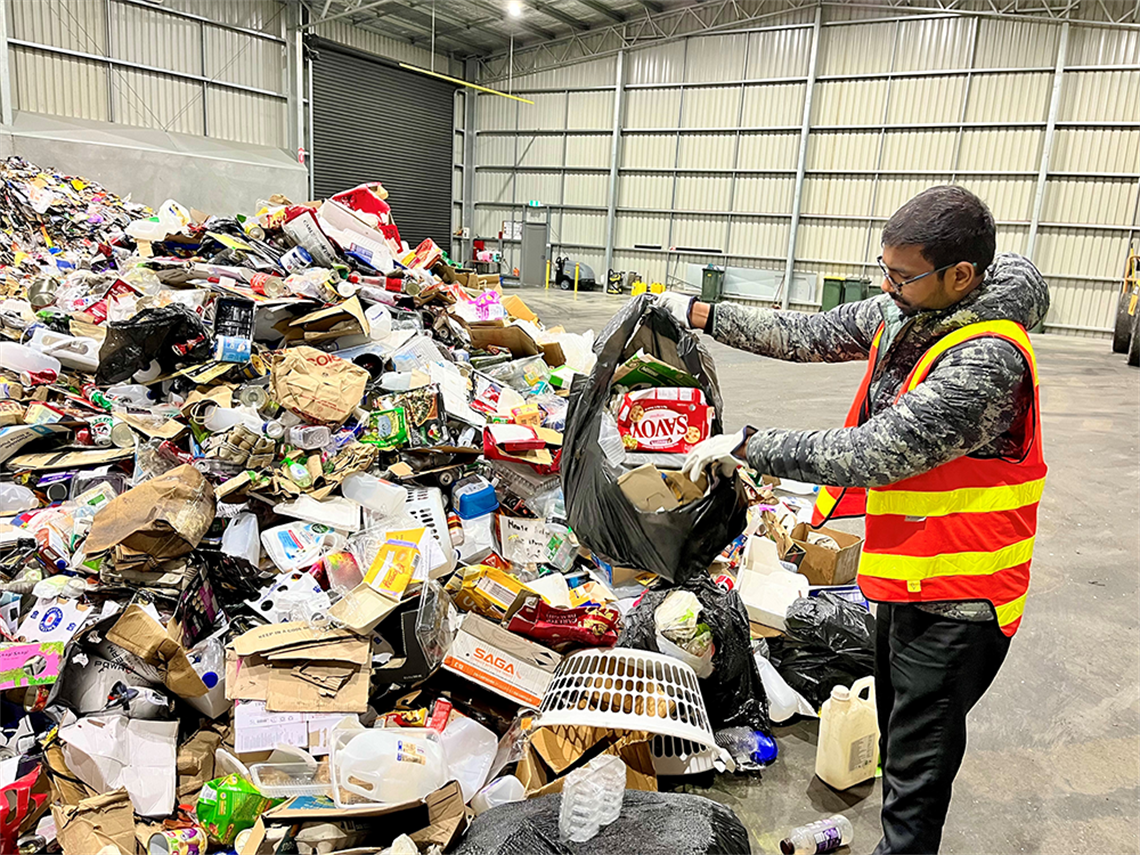Viswatej Dadepogu with recycling in bags (web).png