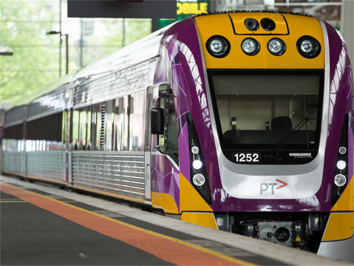 a very shiney train at a platform